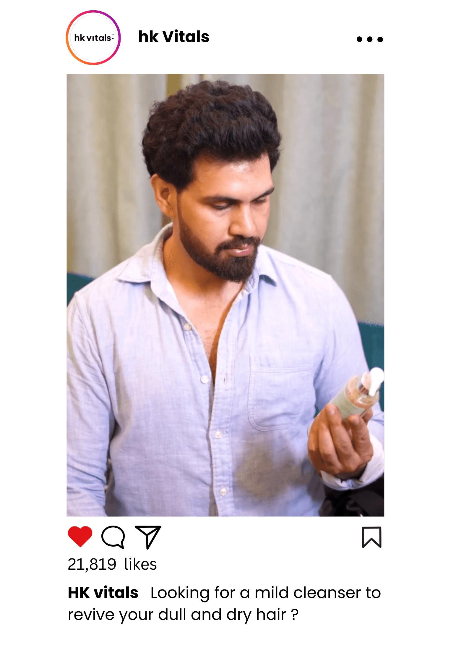 Person holding HK Vitals product during a video shoot for marketing purposes.