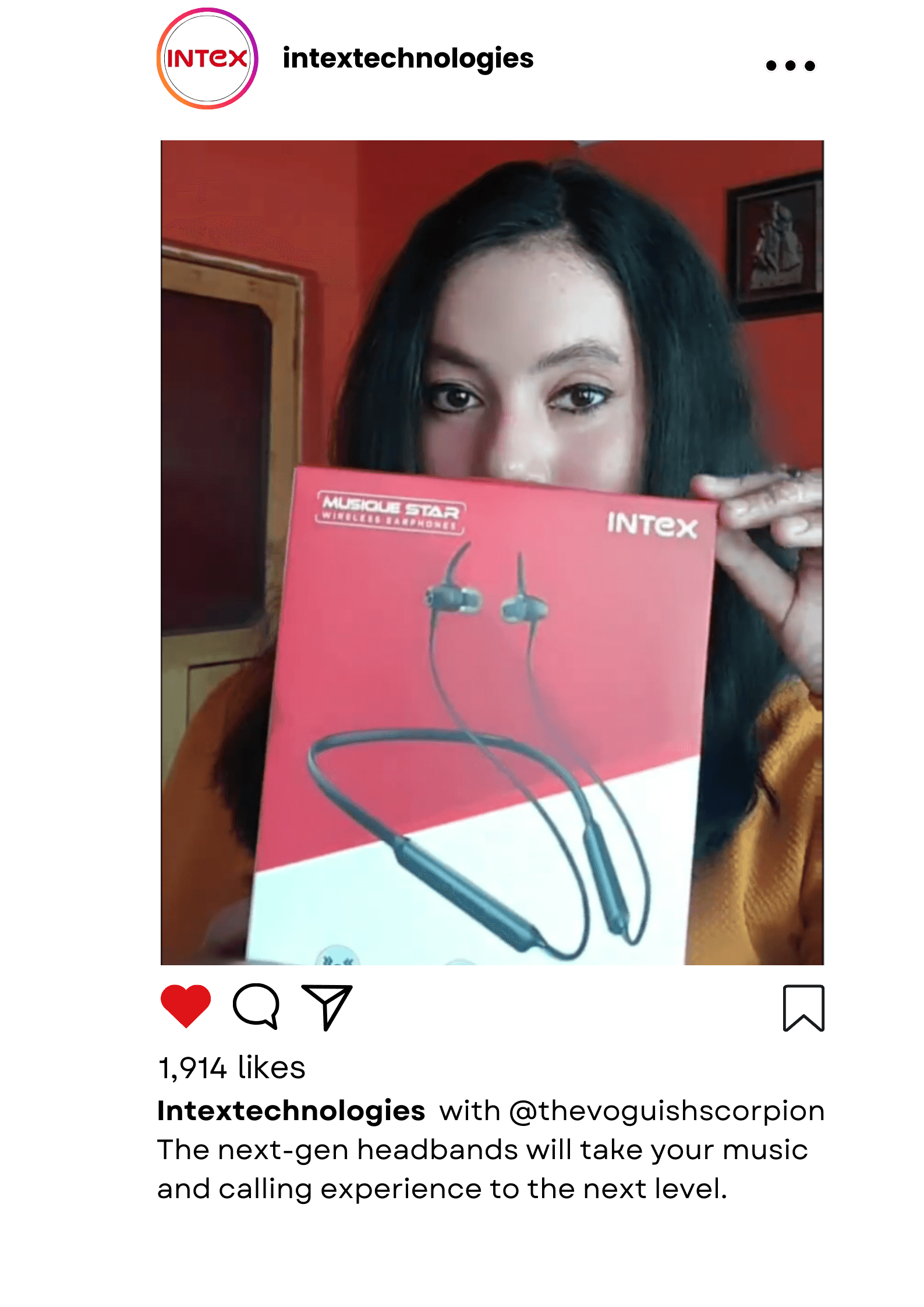 A woman holds an Intex Musique Star wireless earphones box during a video shoot for product marketing and promotion.