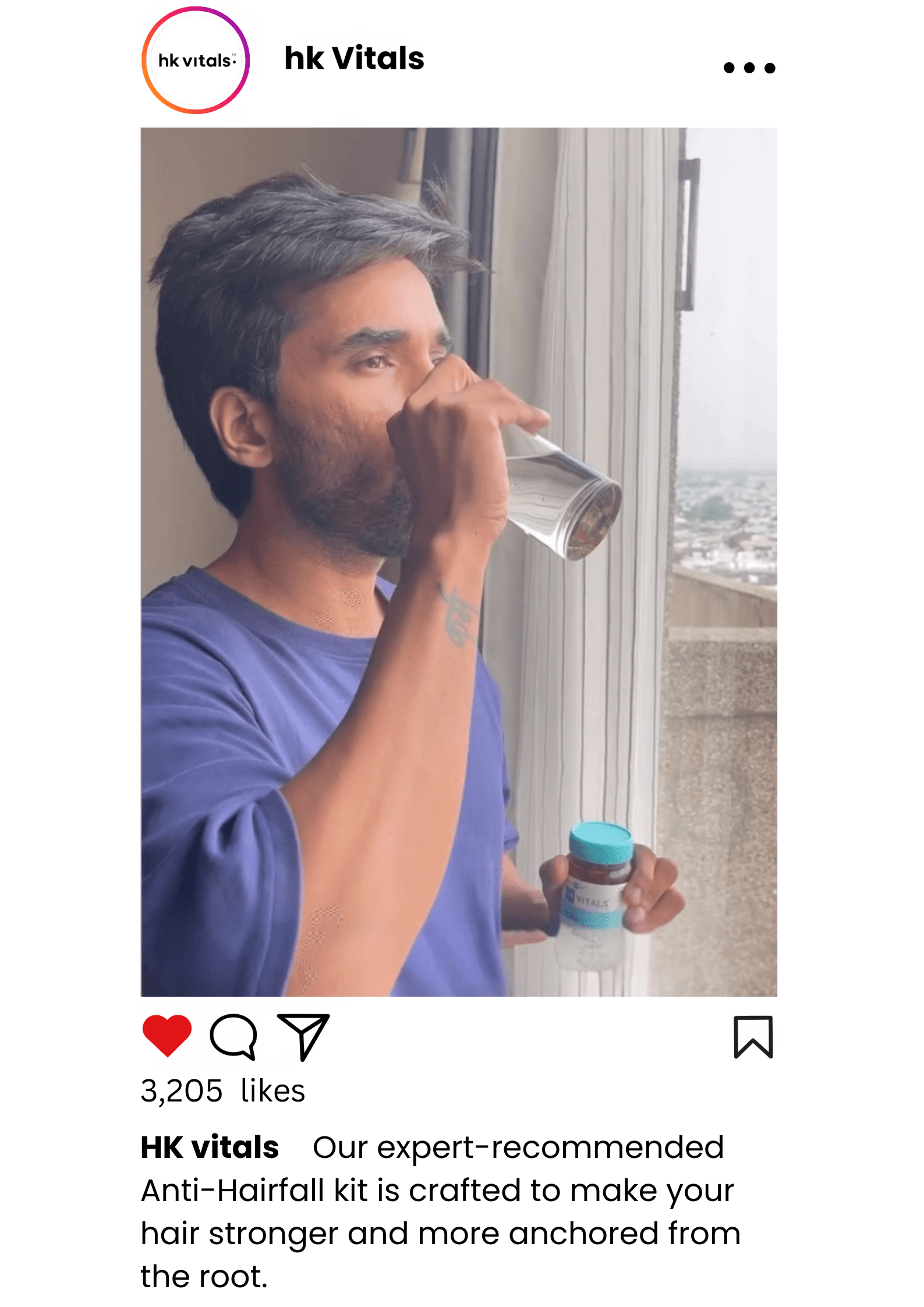 In this video shoot for marketing of HK vitals. A man in blue shirt holding HK Vitals product consuming product with water.